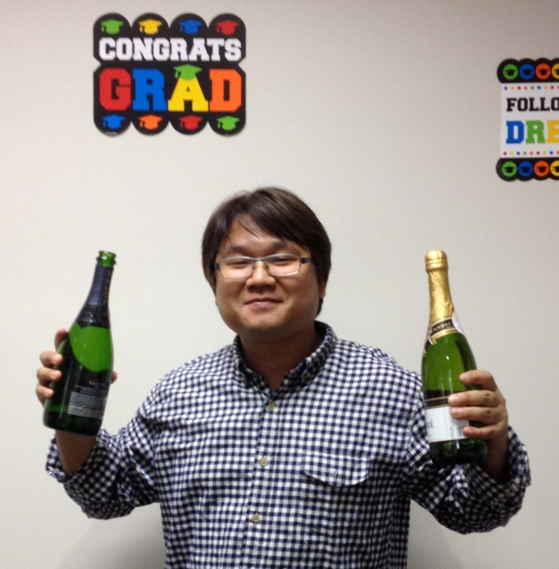 Gil Ju toasts to his new doctorate degree