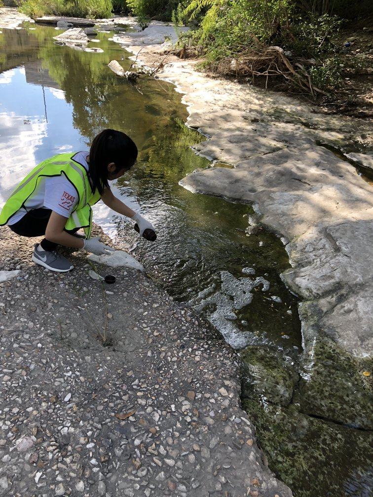 The author collecting a Waller creek sample.