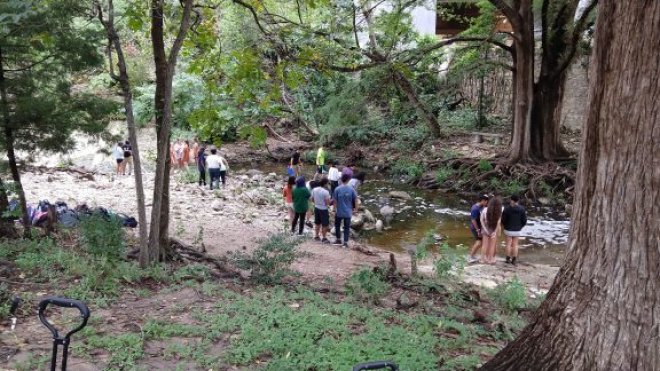 Students sampling by the creek